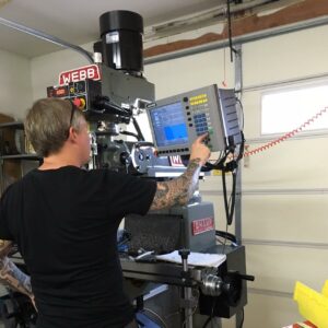 Dan Kubin working in garage with Webb milling machine